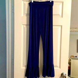 “Adorn” pants with a dressy look and casual feel with ruffled bottom.